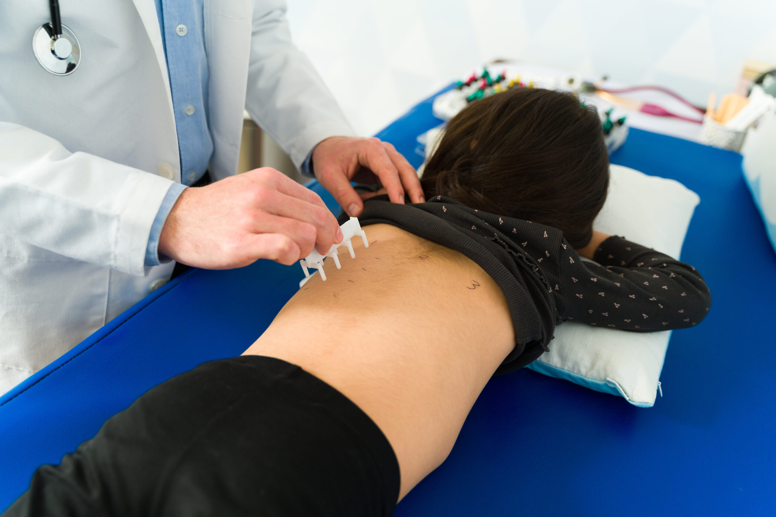A child using a blue asthma inhaler