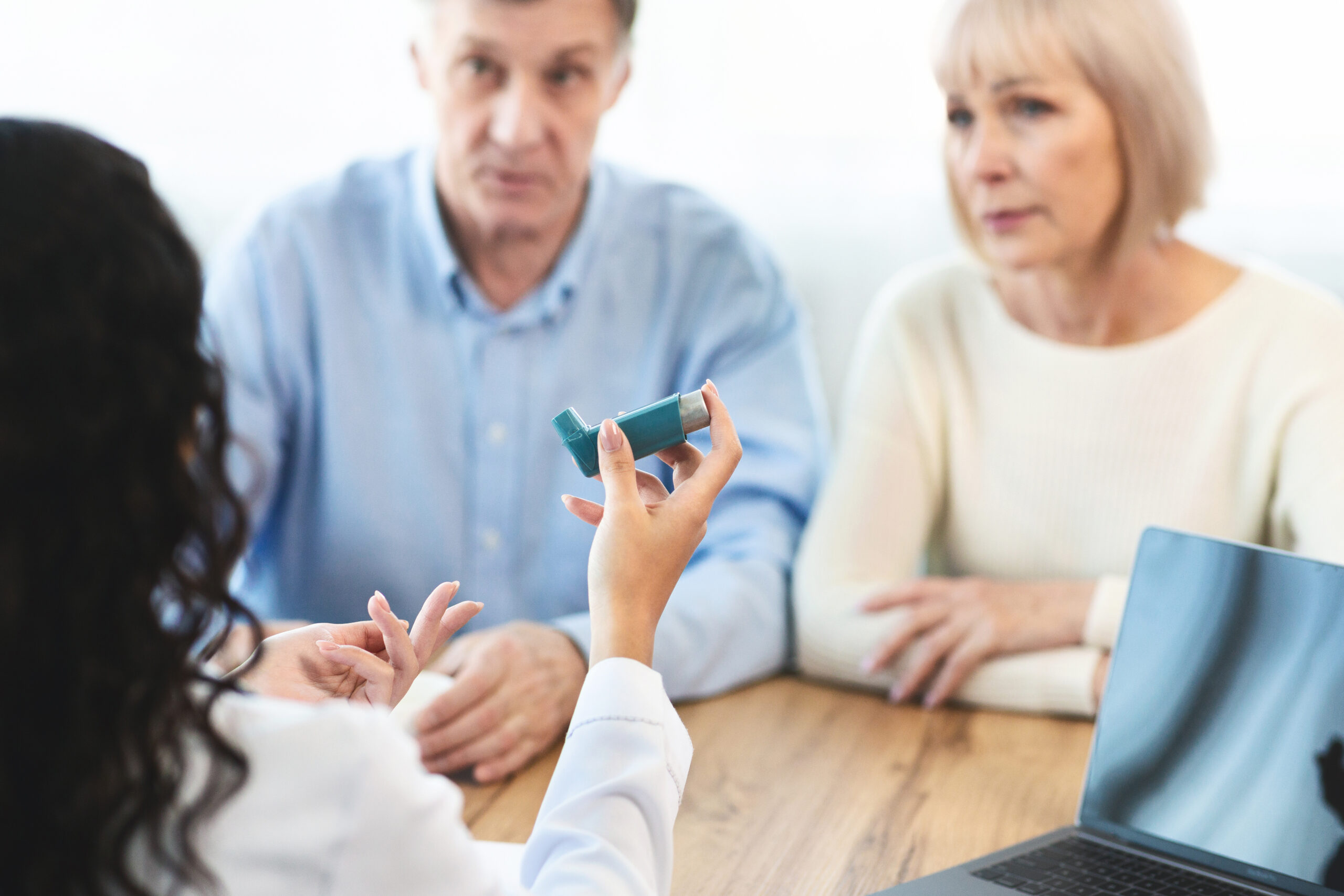 A child using a blue asthma inhaler